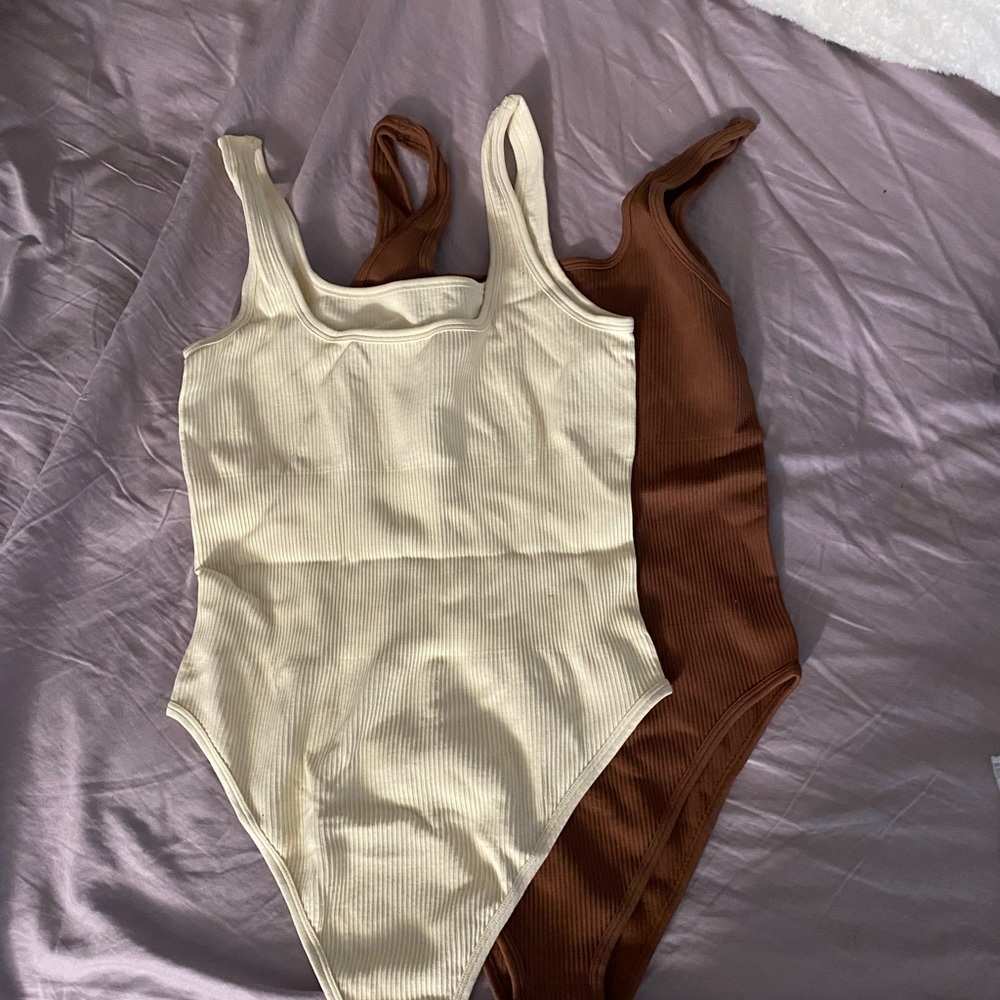 2 brand new tank top style body suits